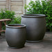 Brooke Planter in ash color on concrete in the backyard.