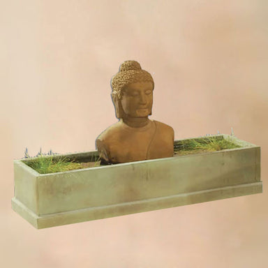 Buddah Trough Fountain against brown background.