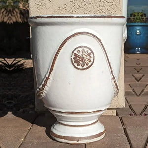 Campania Anduze Urn Planter antique white upclose on red brick paver patio