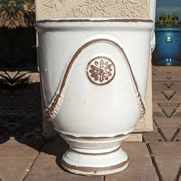 Campania Anduze Urn Planter antique white upclose on red brick paver patio