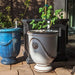 Campania Anduze Urn planters on red brick patio