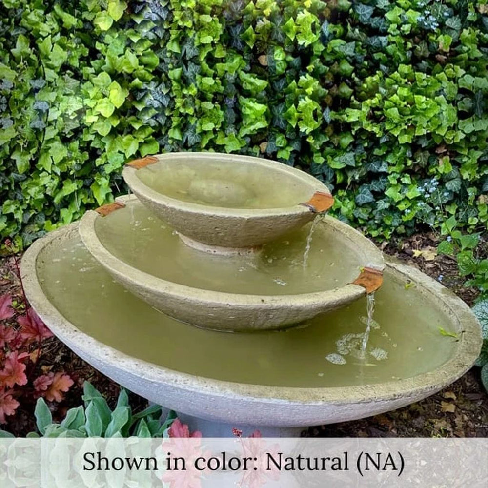 Carrera Oval Fountain in action against green leaves.