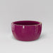 Casablanca Bowl Fiberglass Planter in gloss eggplant against gray background.