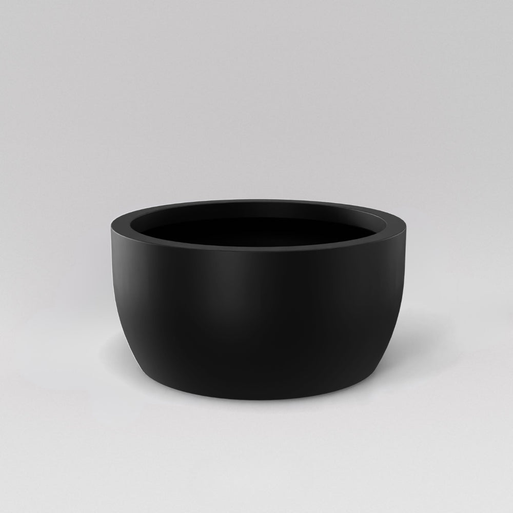 Casablanca Bowl Fiberglass Planter in matte black against gray background.