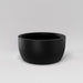 Casablanca Bowl Fiberglass Planter in matte black against gray background.