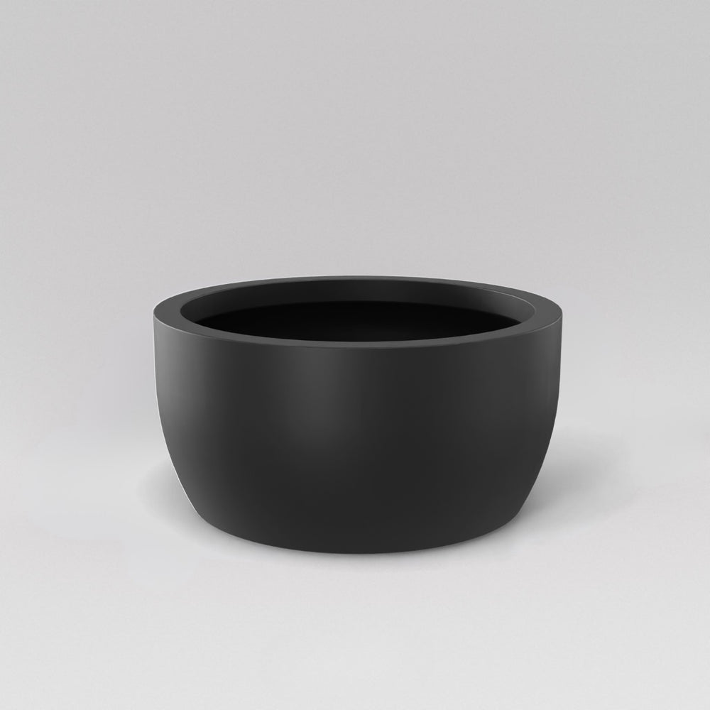 Casablanca Bowl Fiberglass Planter in matte charcoal against gray background.