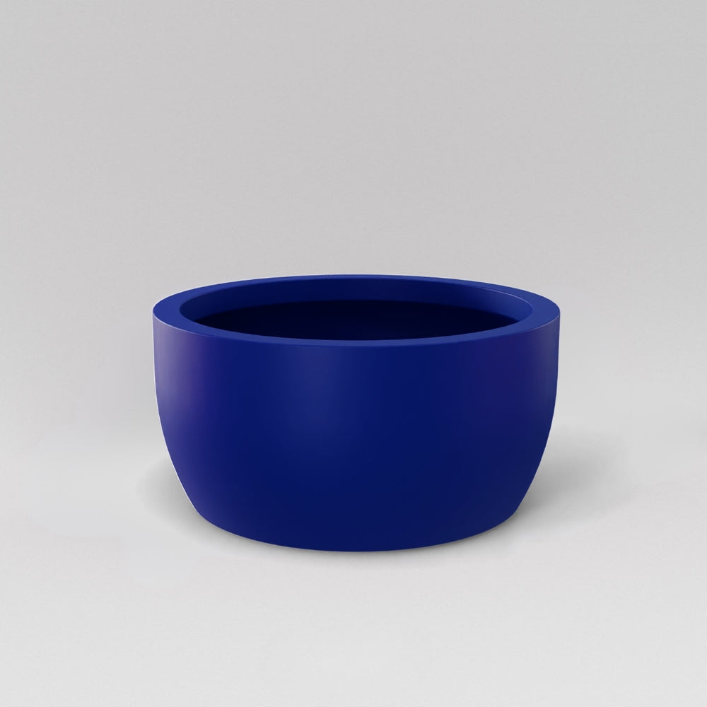 Casablanca Bowl Fiberglass Planter in matte cobalt blue against gray background.