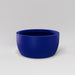 Casablanca Bowl Fiberglass Planter in matte cobalt blue against gray background.