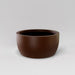 Casablanca Bowl Fiberglass Planter in matte dark brown against gray background.