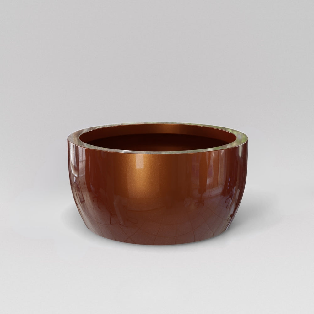 Casablanca Bowl Fiberglass Planter in metallic bronze against gray background.