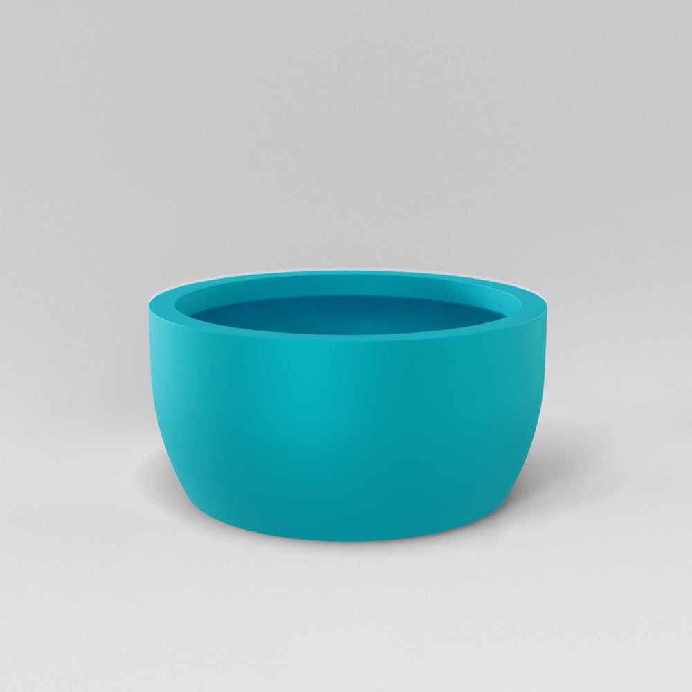 Casablanca Bowl Fiberglass Planter in satin seafoam green against gray background.