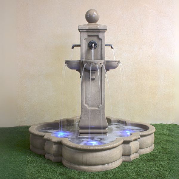 Catalina Pond Fountain on grass against brown background.