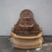 Chateau Wall Fountain in action against concrete wall.