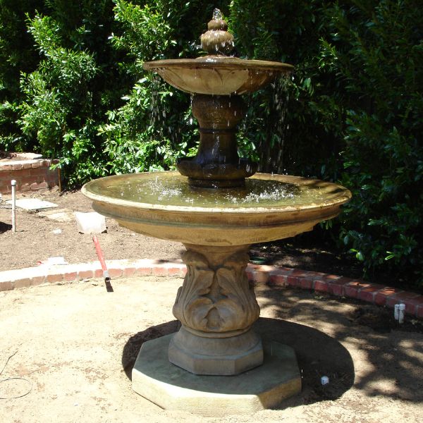 Chelsea Garden Fountain with Step on concrete in the backyard.
