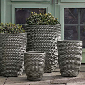 Coin Pot, Tall - Pewter Green - S/4 on concrete filled with plants