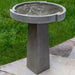 Concept Birdbath on concrete in the backyard