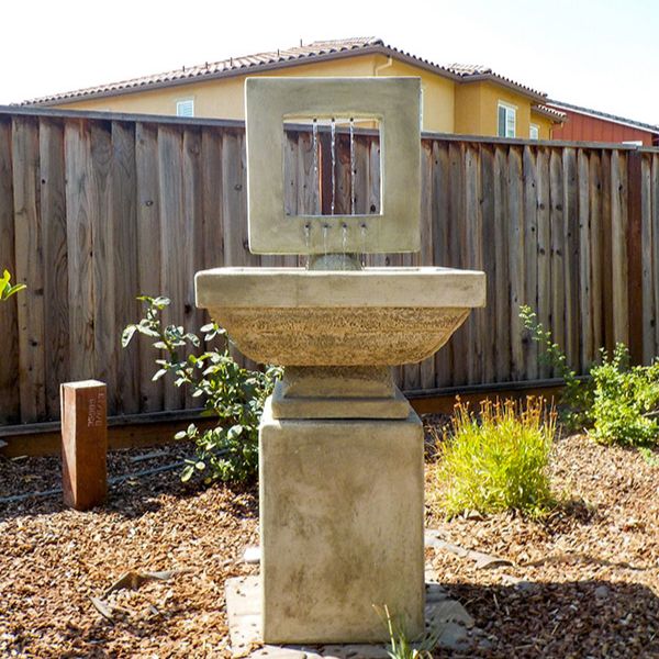 Contempo Squre Fountain, Tall on concrete in the backyard.