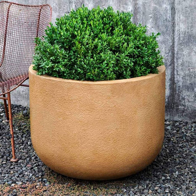 Contour 2822 Planter on gravel filled with plants