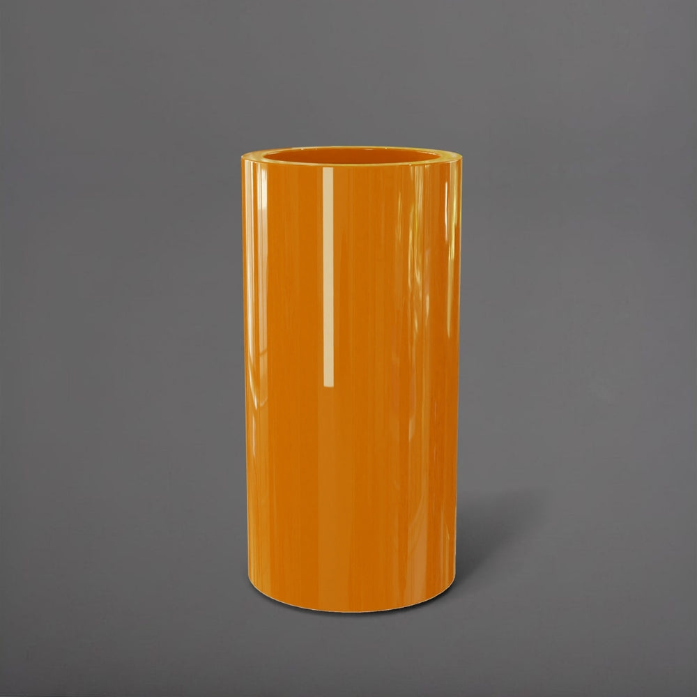 Corry Tall Cylinder Fiberglass Planter in gloss tangerine against gray background. 