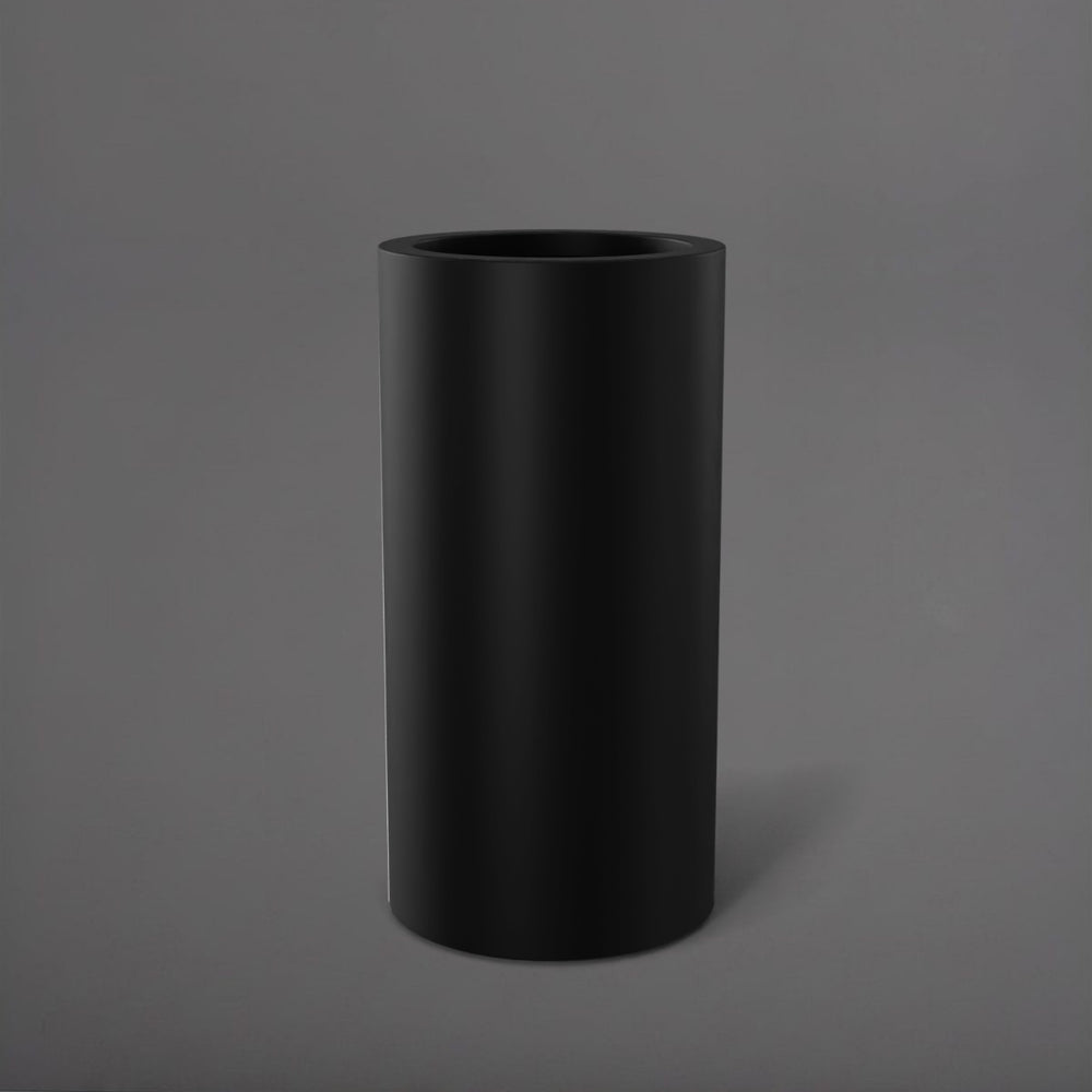 Corry Tall Cylinder Fiberglass Planter in matte black against gray background. 