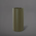 Corry Tall Cylinder Fiberglass Planter in matte bronze against gray background. 