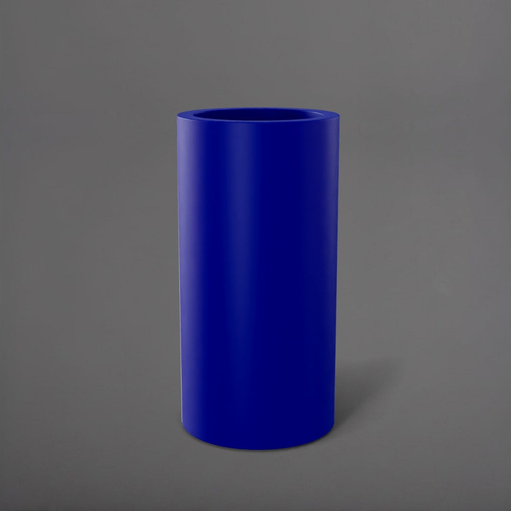 Corry Tall Cylinder Fiberglass Planter in matte cobalt blue against gray background. 