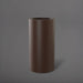Corry Tall Cylinder Fiberglass Planter in matte dark brown against gray background. 