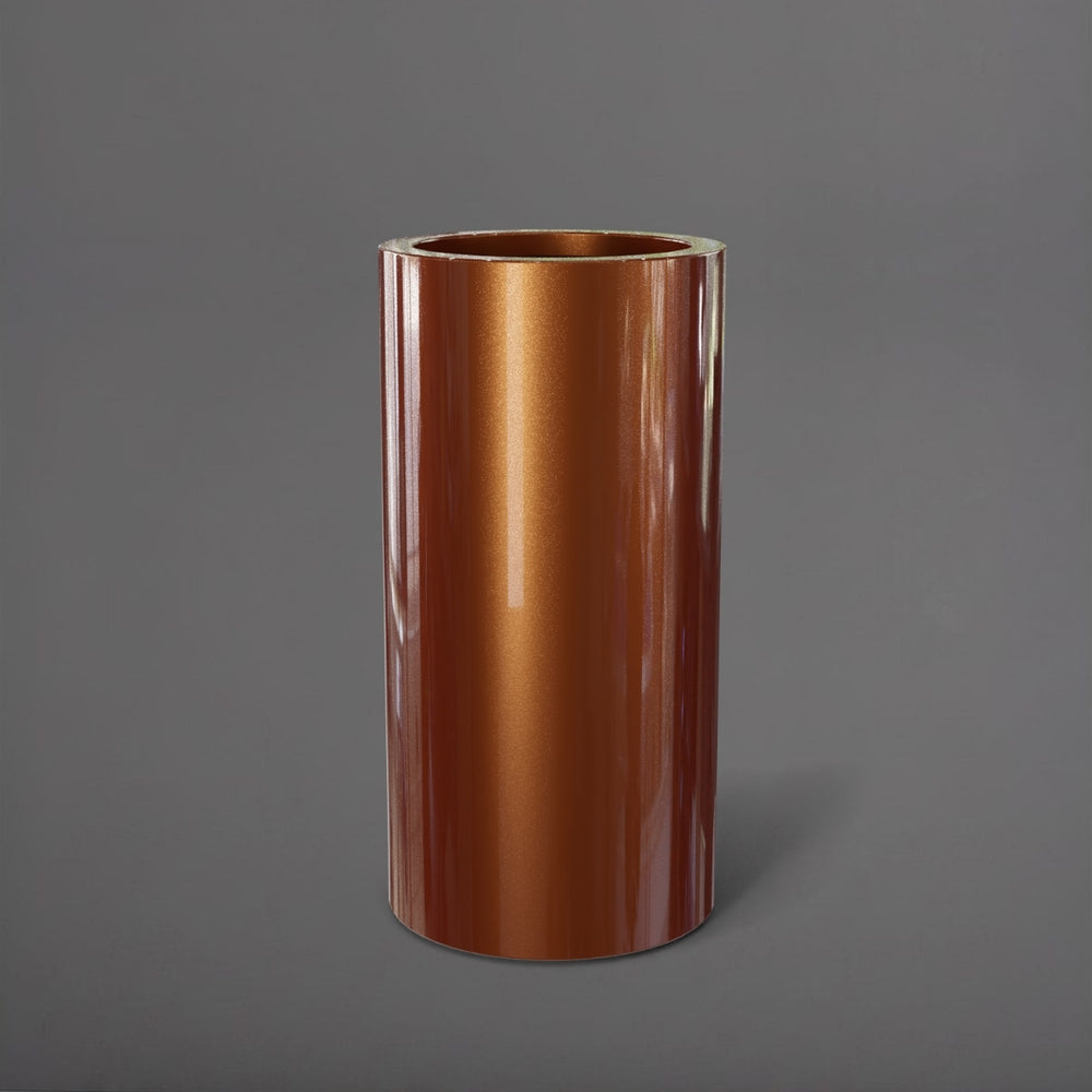 Corry Tall Cylinder Fiberglass Planter in metallic bronze against gray background. 