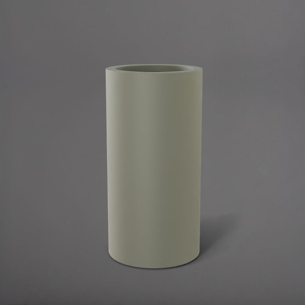 Corry Tall Cylinder Fiberglass Planter in satin beige against gray background. 