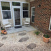 Cortona Planter - Terra Cotta - S/3 filled with plants outside the house