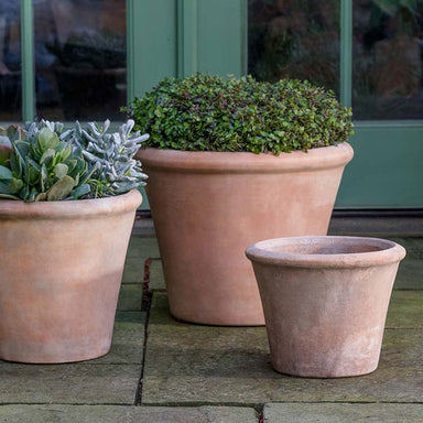 Cortona Planter - Terra Cotta - S/3 on concrete in the backyard