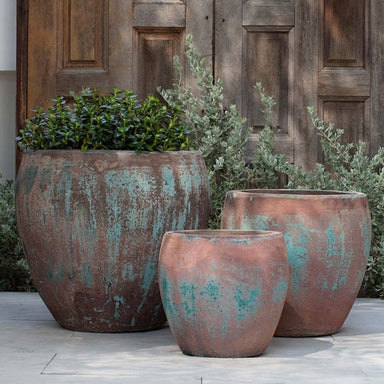 Cove Planter - Vicolo Rutico - S/3 on concrete in the backyard