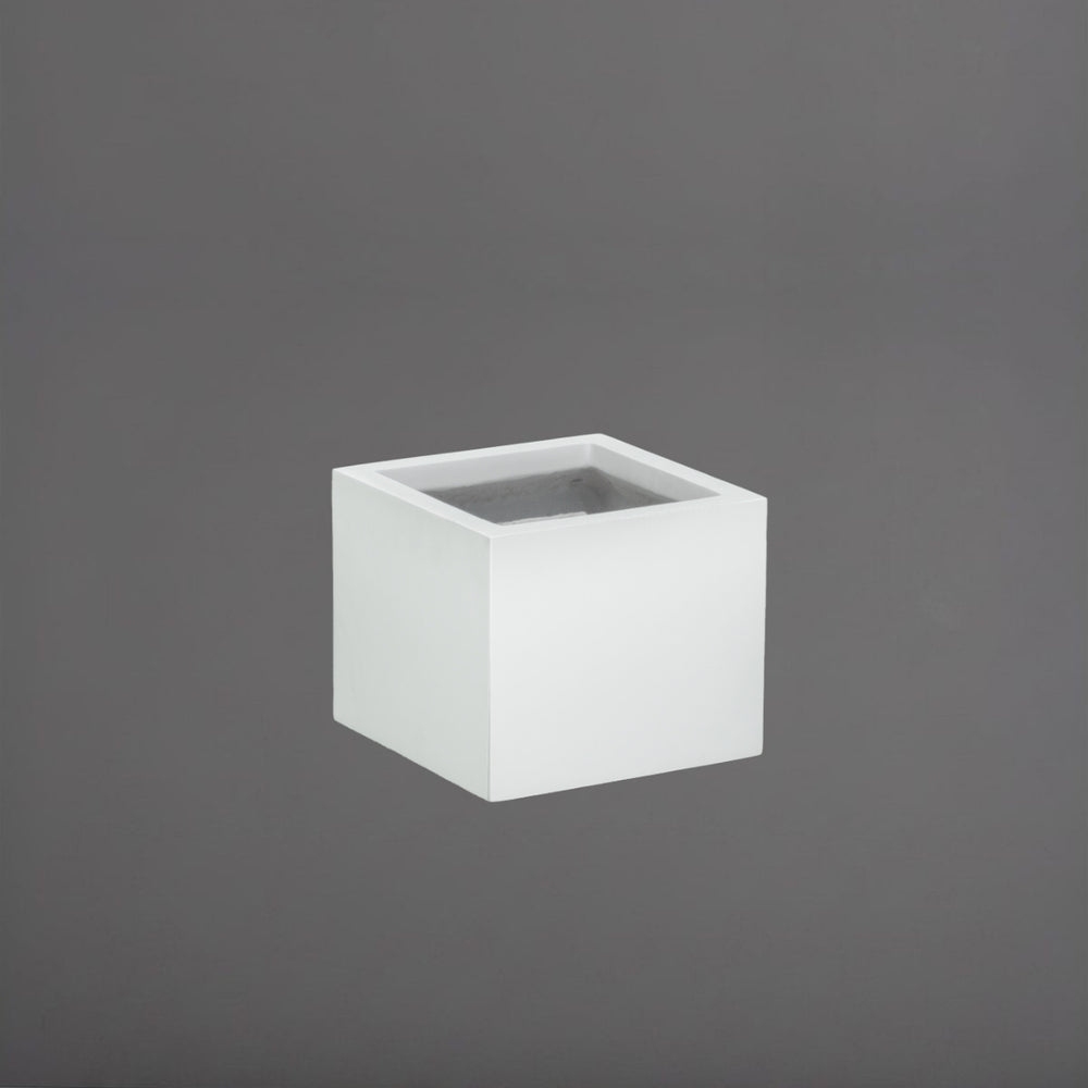 Cuba Low Corner Fiberglass Planter in gloss bright white against gray background.