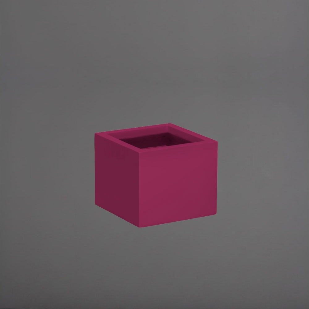 Cuba Low Corner Fiberglass Planter in gloss eggplant  against gray background.