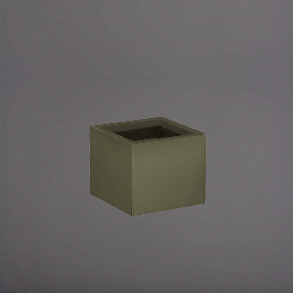 Cuba Low Corner Fiberglass Planter in matte bronze against gray background.