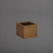 Cuba Low Corner Fiberglass Planter in metallic bronze against gray background.