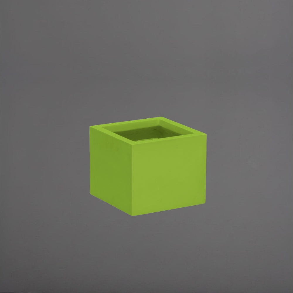 Cuba Low Corner Fiberglass Planter in satin green against gray background.