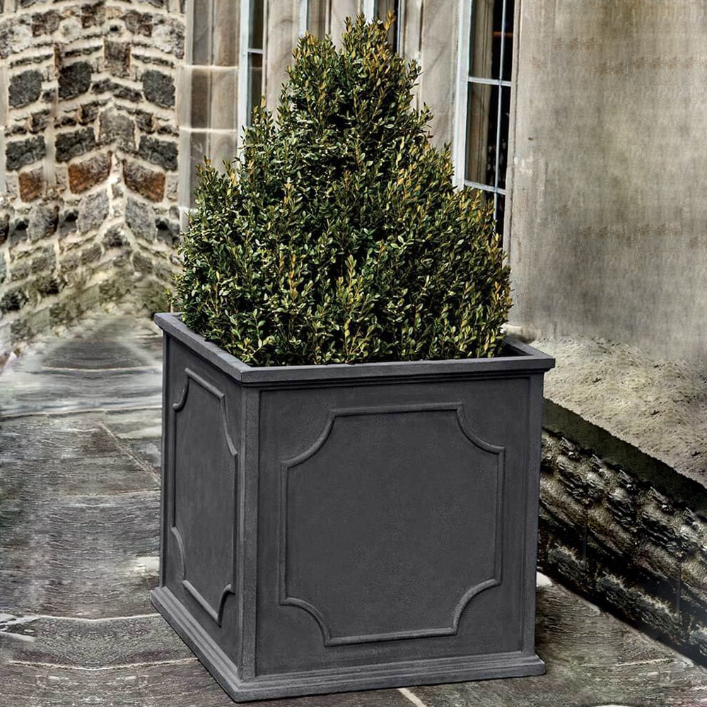 Cumberland Square Planter, Large on concrete filled with plants.