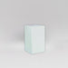 Darwin Tall Corner Fiberglass Planter in gloss bright white against gray background.