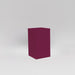Darwin Tall Corner Fiberglass Planter in gloss eggplant against gray background.