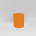 Darwin Tall Corner Fiberglass Planter in gloss tangerine against gray background.
