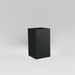 Darwin Tall Corner Fiberglass Planter in matte black against gray background.