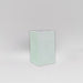 Darwin Tall Corner Fiberglass Planter in matte bright white against gray background.