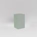 Darwin Tall Corner Fiberglass Planter in matte cement grey against gray background.