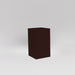 Darwin Tall Corner Fiberglass Planter in matte dark brown against gray background.
