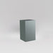 Darwin Tall Corner Fiberglass Planter in matte gunmetal against gray background.