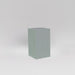 Darwin Tall Corner Fiberglass Planter in metallic silver against gray background.