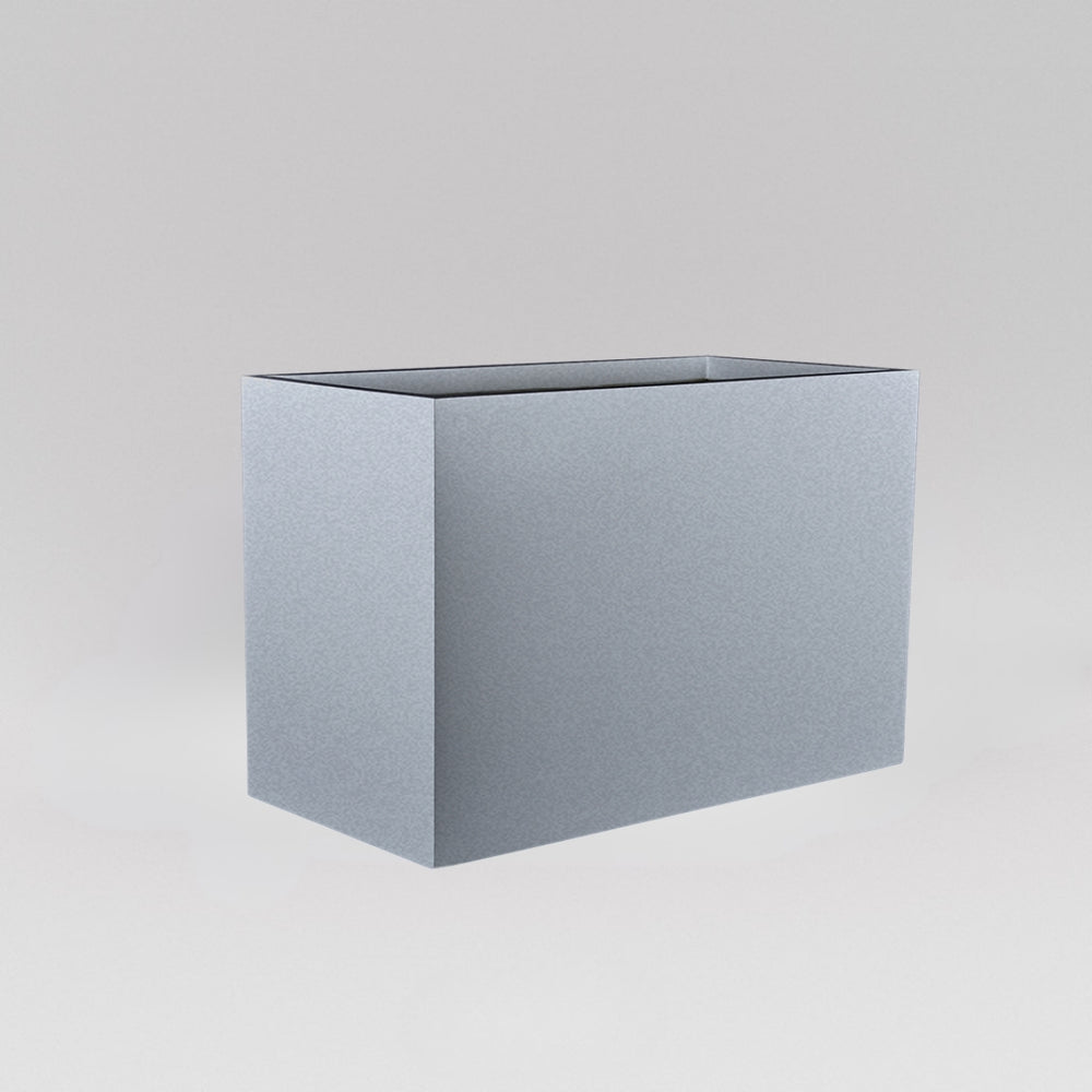 Darwin Tall Rectangle Fiberglass Planter in metallic silver against gray background.