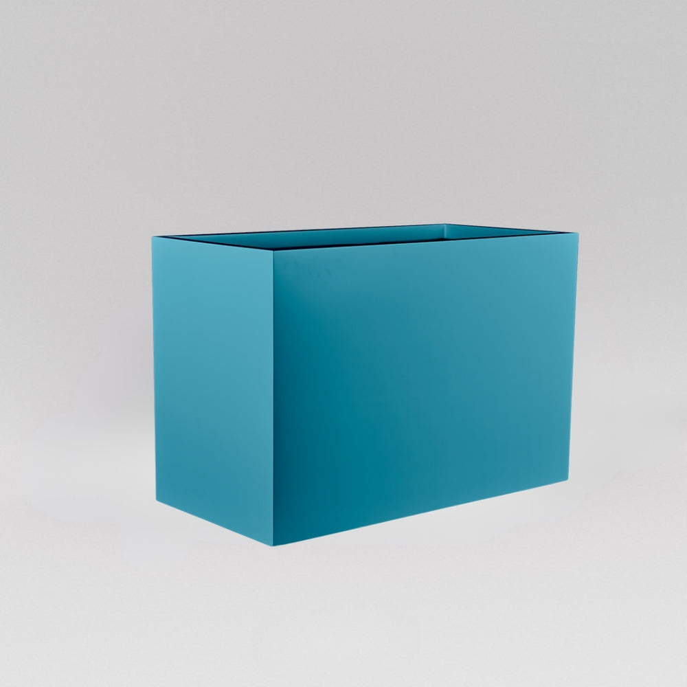 Darwin Tall Rectangle Fiberglass Planter in satin seafoam green against gray background.