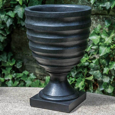 Deco Urn Planter on concrete in the backyard